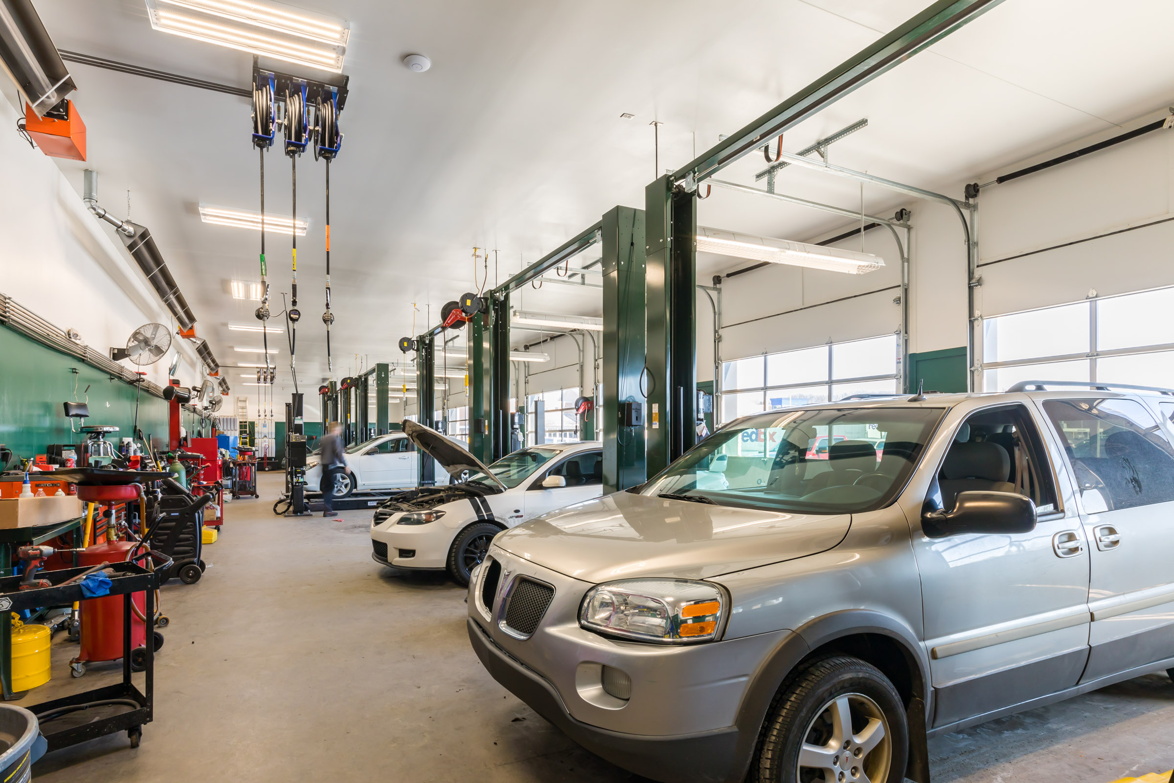 Vehicles in the CBAC garage bays undergoing maintenance